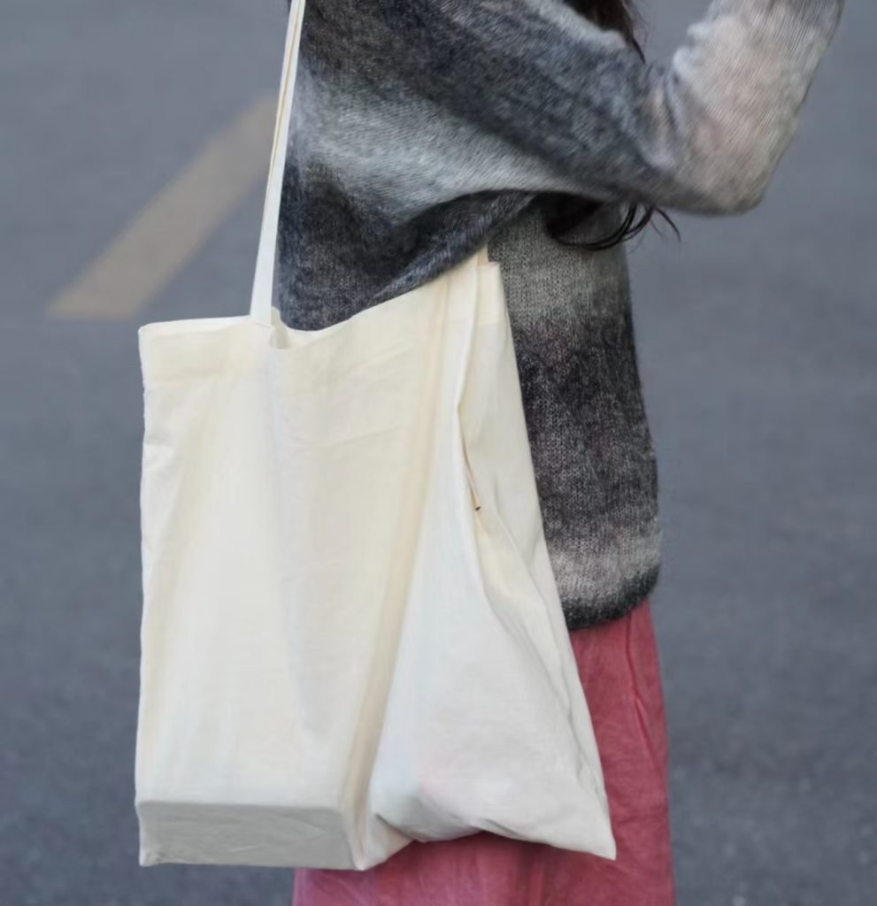cotton and poly-cotton canvas bags shown side by side
