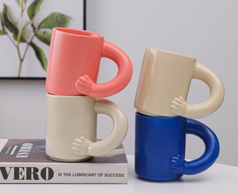 Various ceramic mug styles produced using different firing techniques