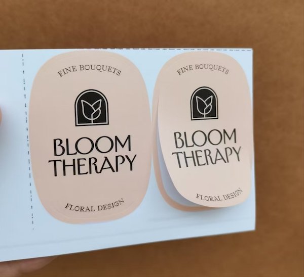 Minimalist stickers with "Bloom Therapy" floral design branding