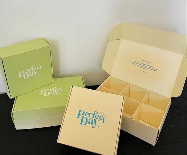 Colorful "Perfect Day" boxes with compartments for packaging