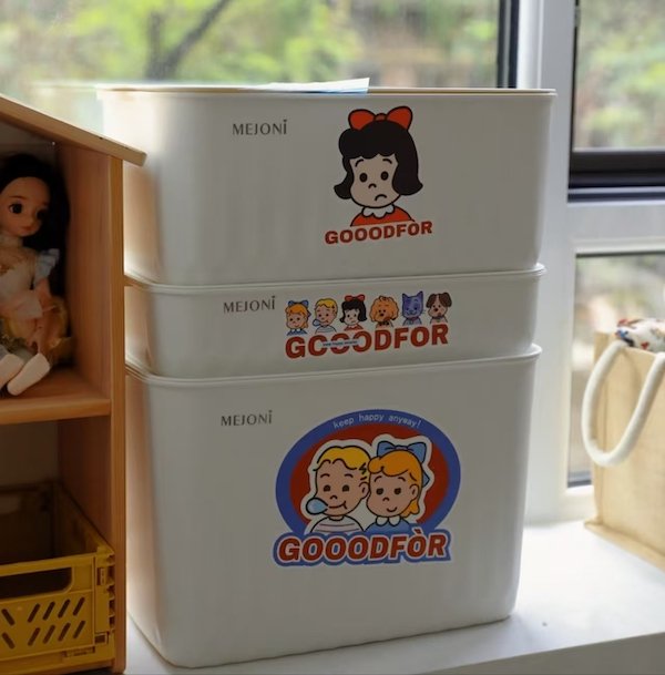Stacked white storage bins with vintage cartoon designs and "GOOODFOR" text