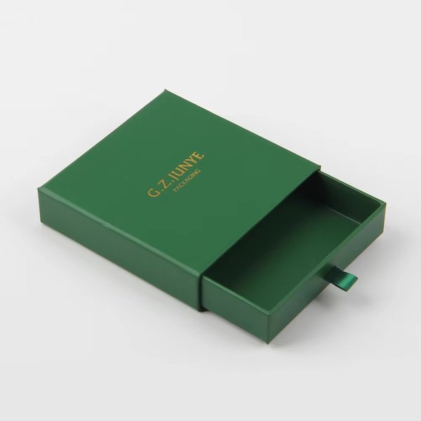 Elegant green sliding drawer box with gold "G.Z. JUNYE PACKAGING" text