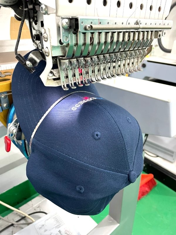 Employees wearing custom hats at a company team event