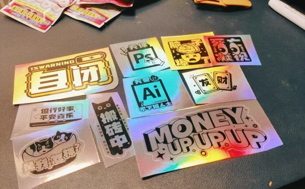 Laser sticker with a shimmering color-shifting reflective effect