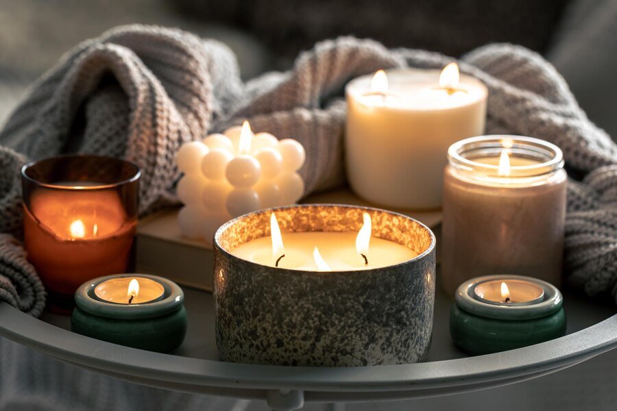 Cozy room interior decorated with softly burning candles
