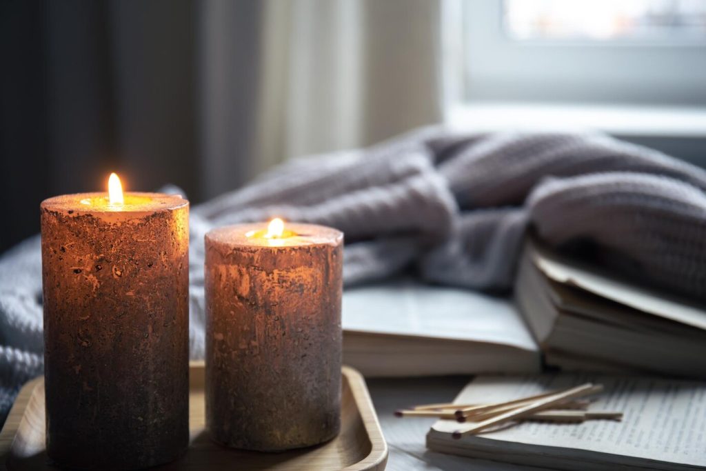 cozy home setting decorated with lit candles