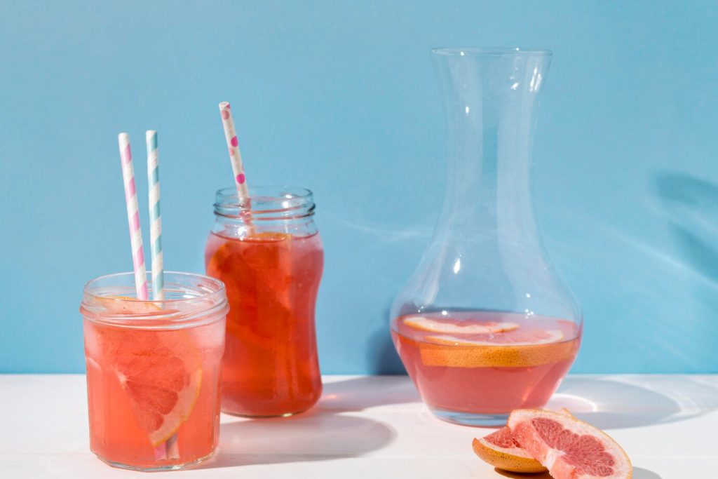 Glass of grapefruit juice showcasing a printed glass cup