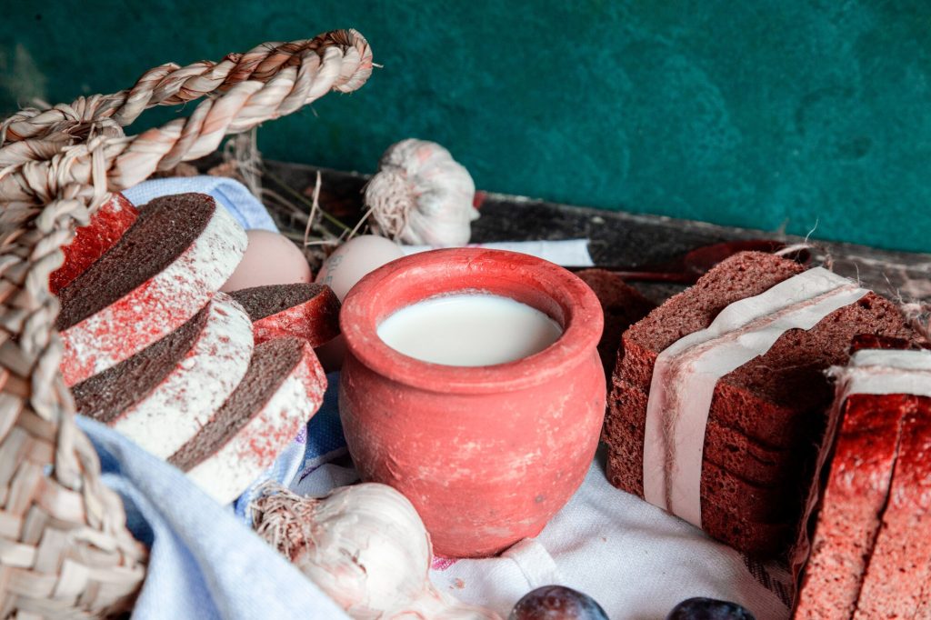 Cozy still life with wrapped bread and a milk pot