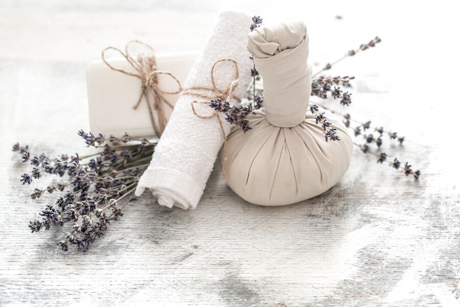 Spa wellness setup with lavender flowers and scented towels