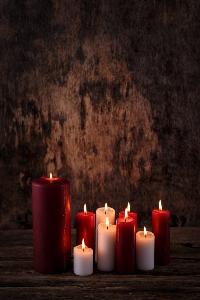 White and red candles displayed together unlit