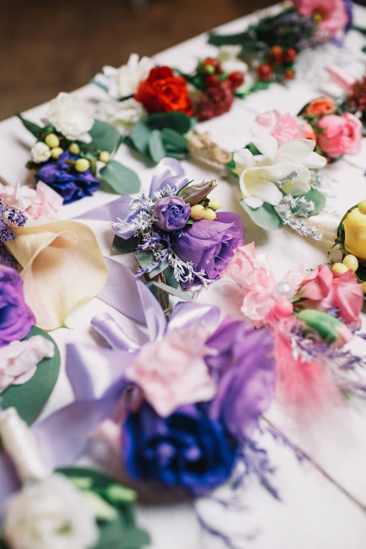 Colorful artificial flower arrangements on table