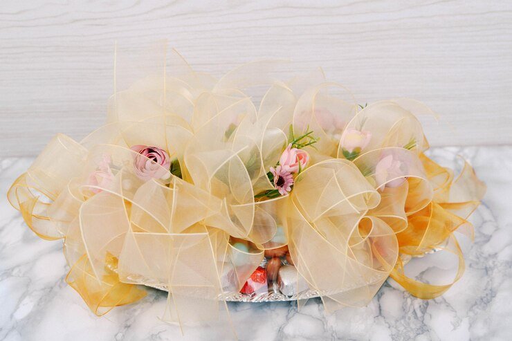 Decorative gift tray with golden ribbons