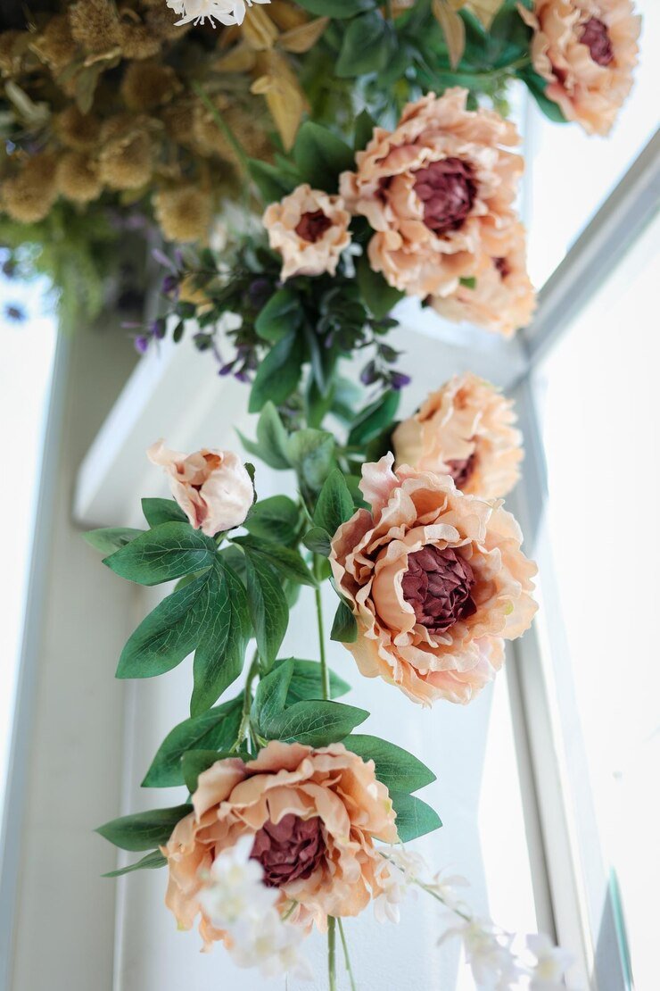 Peach-colored artificial peonies hanging decor