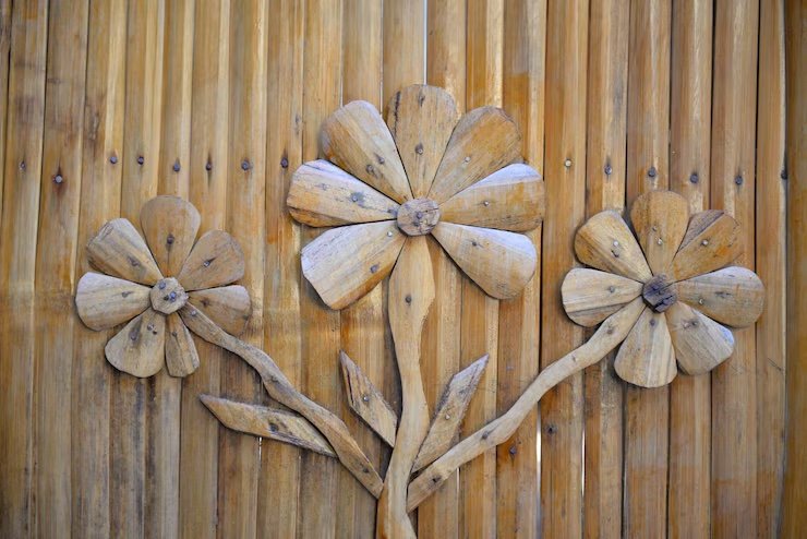wooden flower wall art on bamboo background