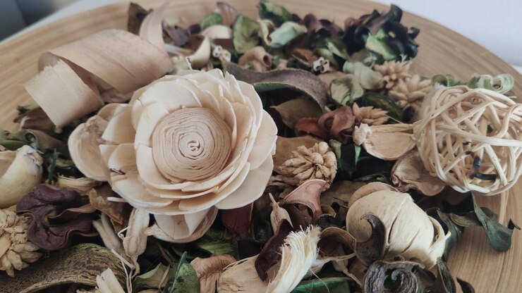 decorative dried petals and wooden flower arrangement