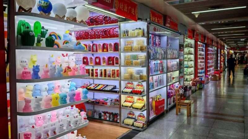 Wholesale market aisle lined with stalls of ready-to-ship goods