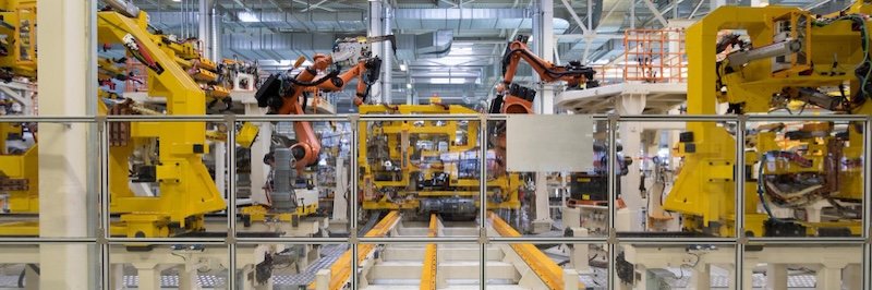 robotic production line manufacturing products during a trial run
